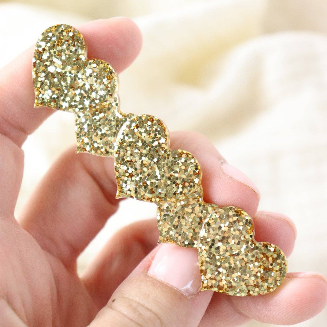 Barrette coeur paillette dorée
