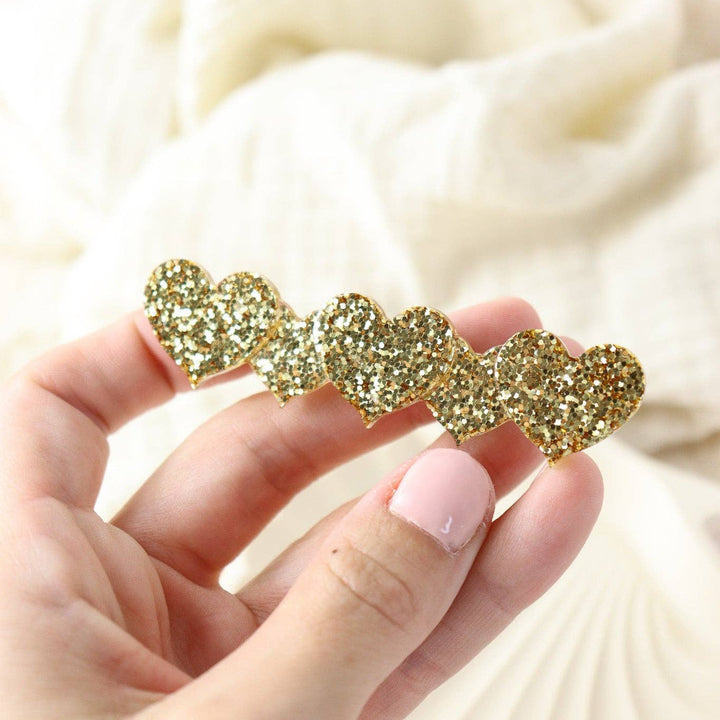 Barrette coeur paillette dorée