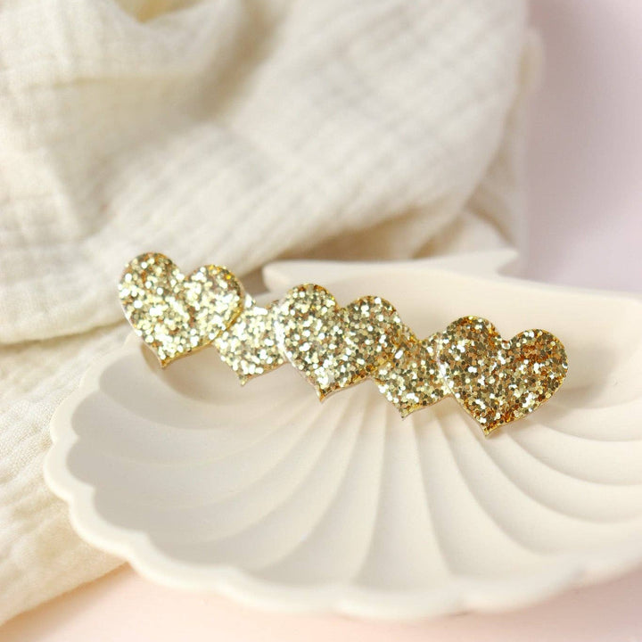 Barrette coeur paillette dorée